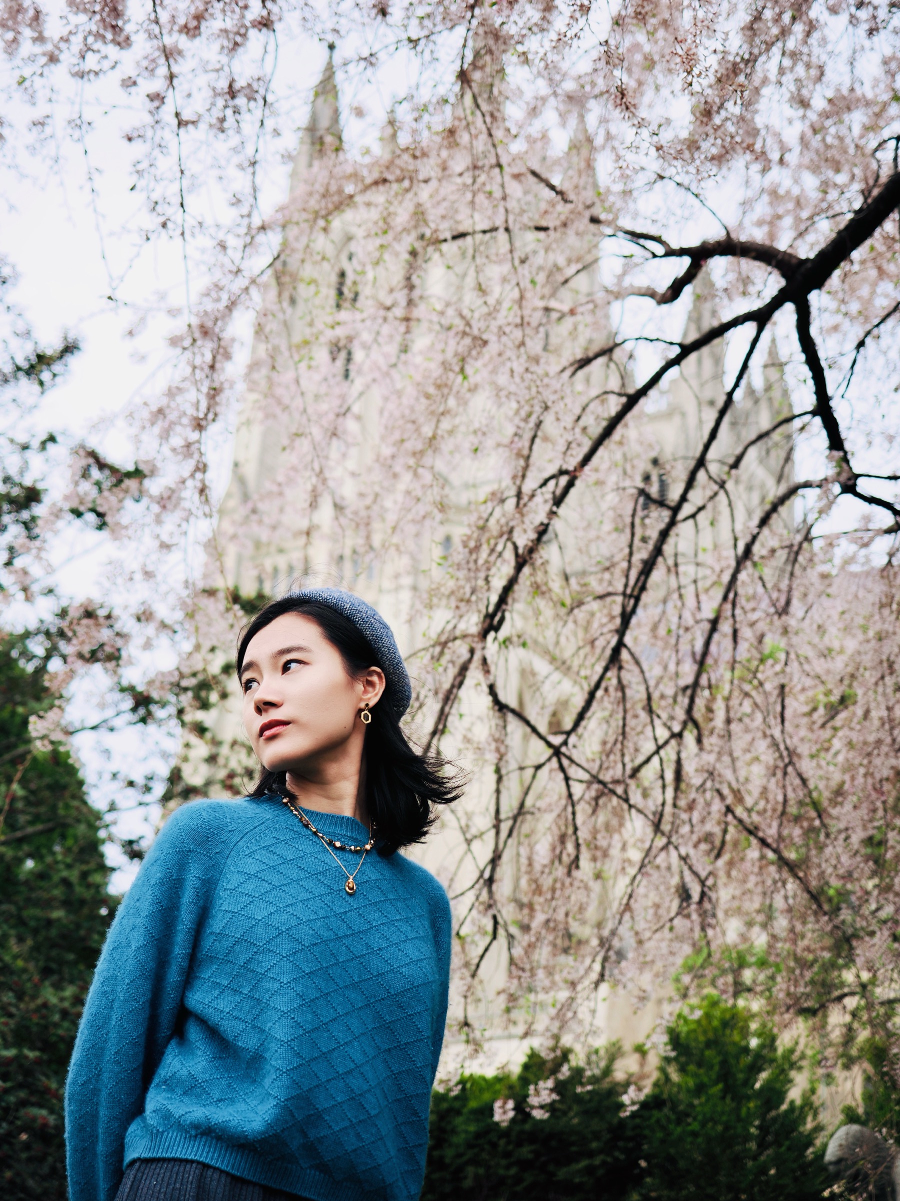 Portrait with cherry blossoms and Washington National Cathedral